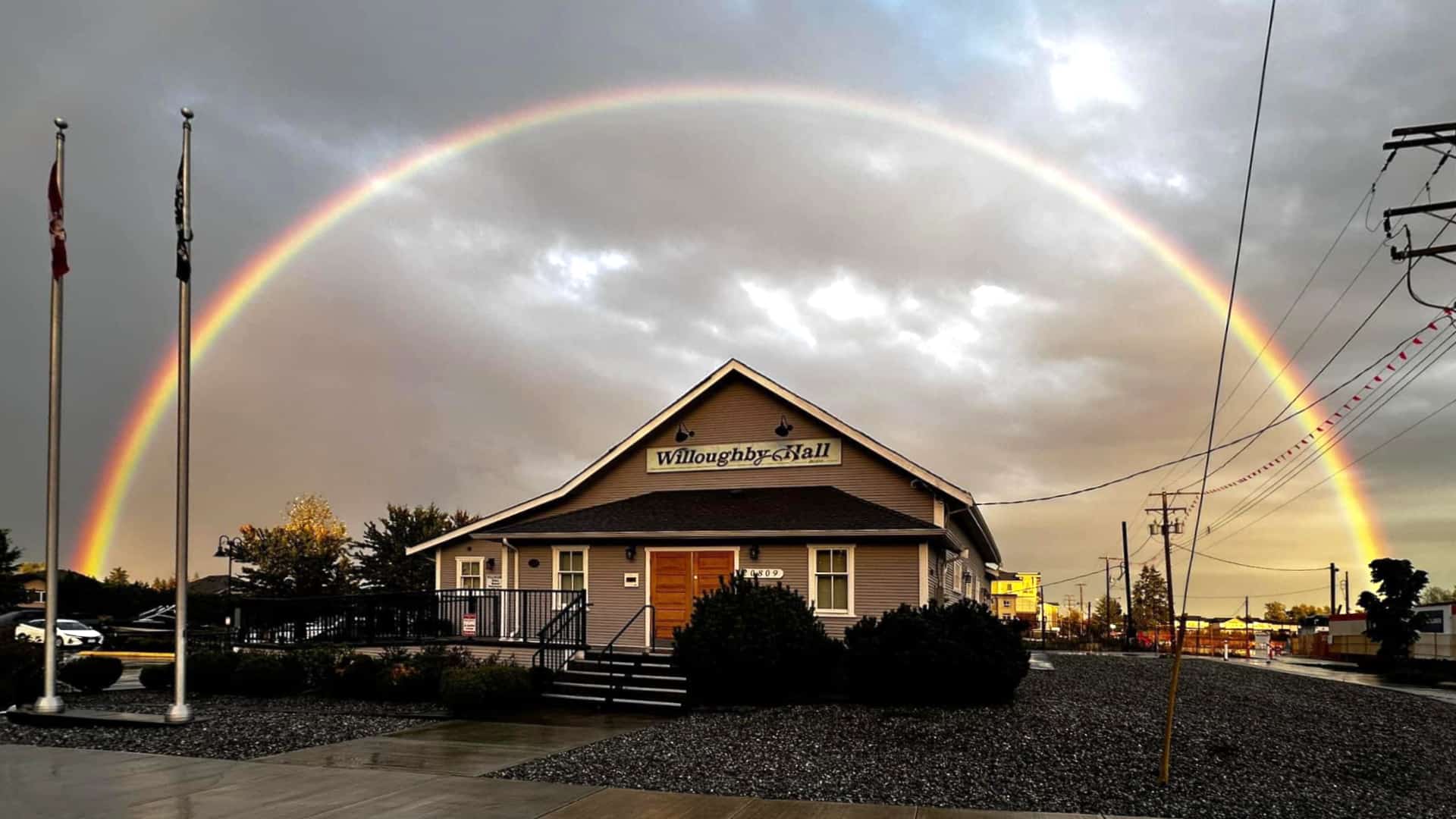 Willoughby Community Hall front view with rainbow